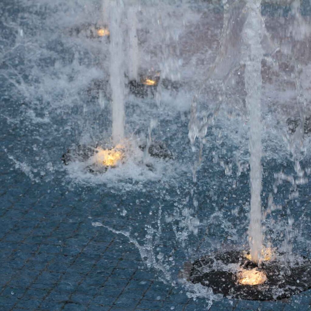 Fountain with light under jets of water shooting into the air.